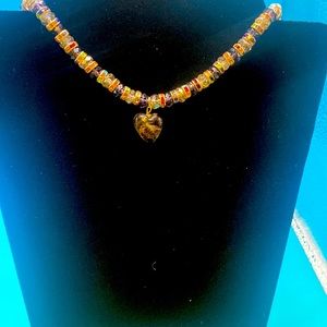 Clear and purple crystal necklace with black crystal heart